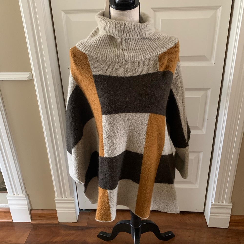 Cape with sleeves
